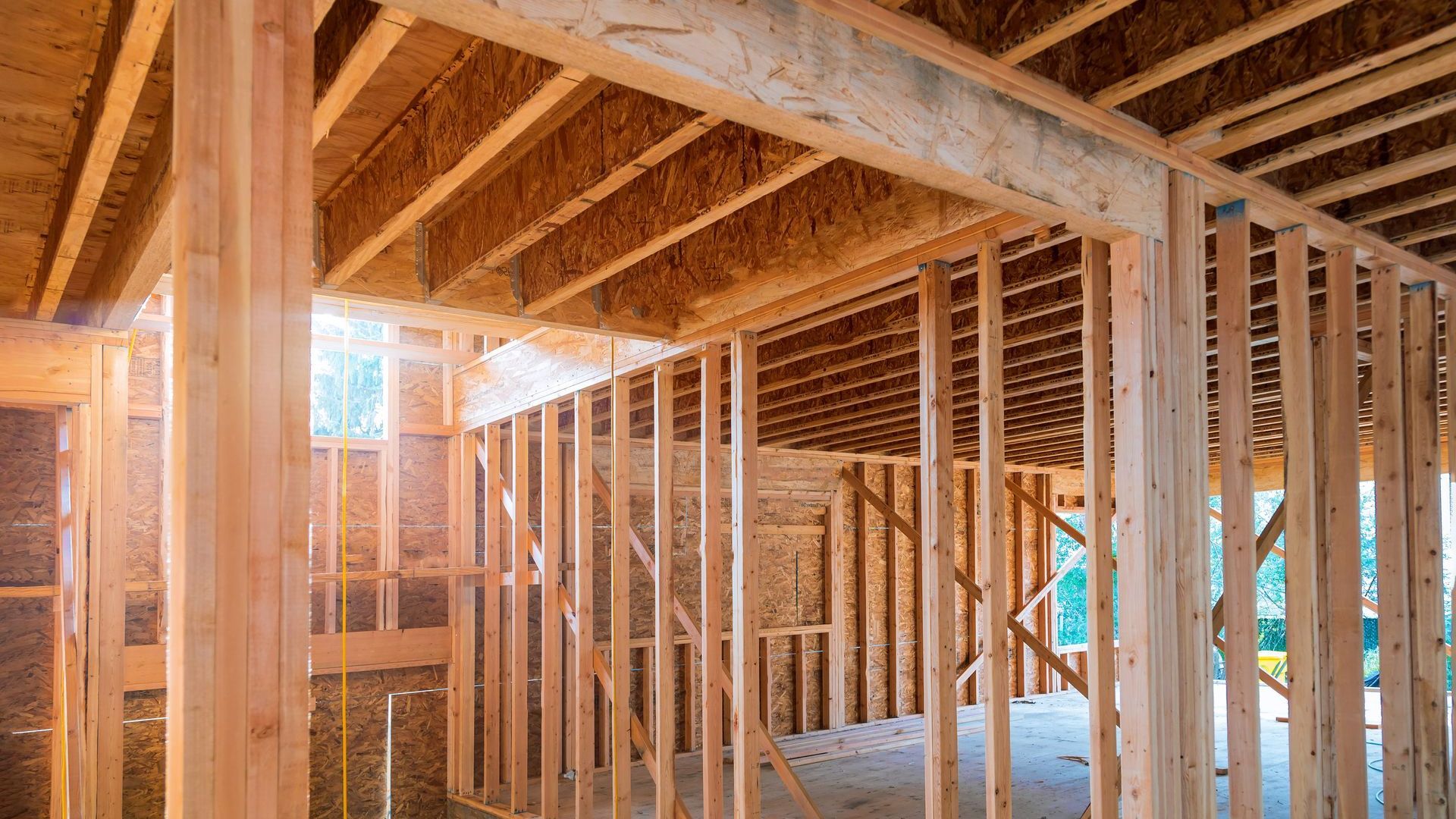 A house is being built with wooden beams.