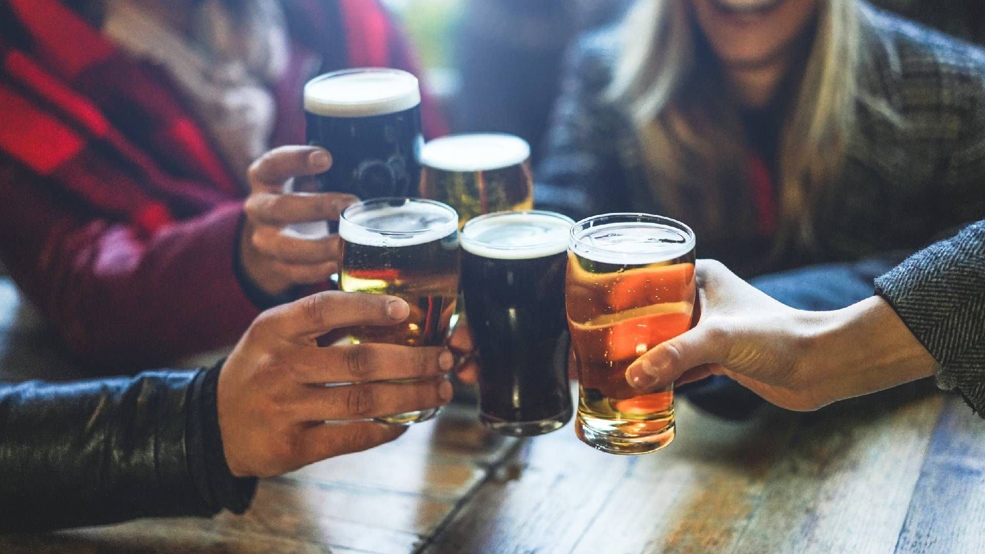 Group of friends toasting beer at a brewery near Lexington, Kentucky