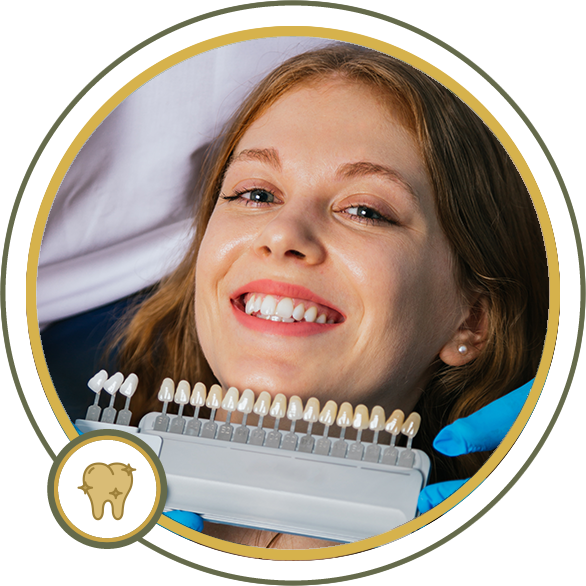 Woman smiling during a teeth whitening procedure. A shade guide is next to her teeth.