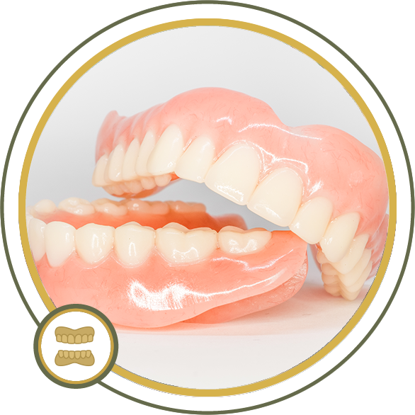 Two dentures, top and bottom, sit open.  Pink gums, white teeth, set in a gold-rimmed circle.