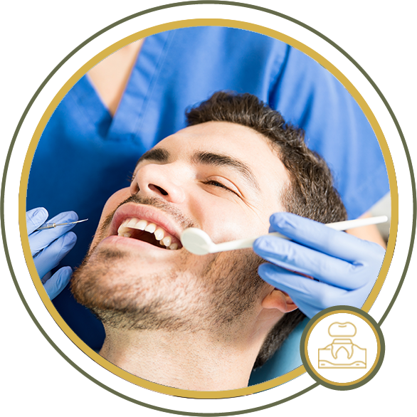 Man in dental chair, mouth open, receiving dental exam. Dentist with tools, blue gloves and scrubs.