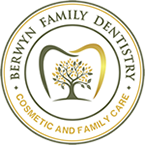 Logo: Berwyn Family Dentistry. Circle with tooth and tree design, gold and green colors.