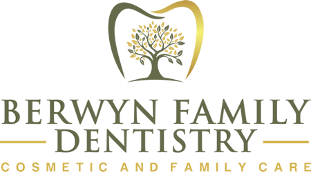 Logo for Berwyn Family Dentistry. Features a tree inside a tooth outline in green and gold, with text.
