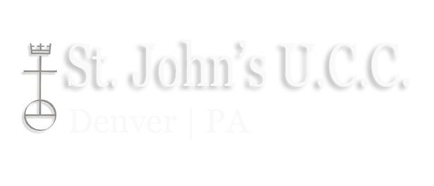 A white logo for st. john 's u.c.c. denver pa