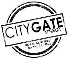 A black and white stamp with the words `` city gate ephrata '' written inside of it.