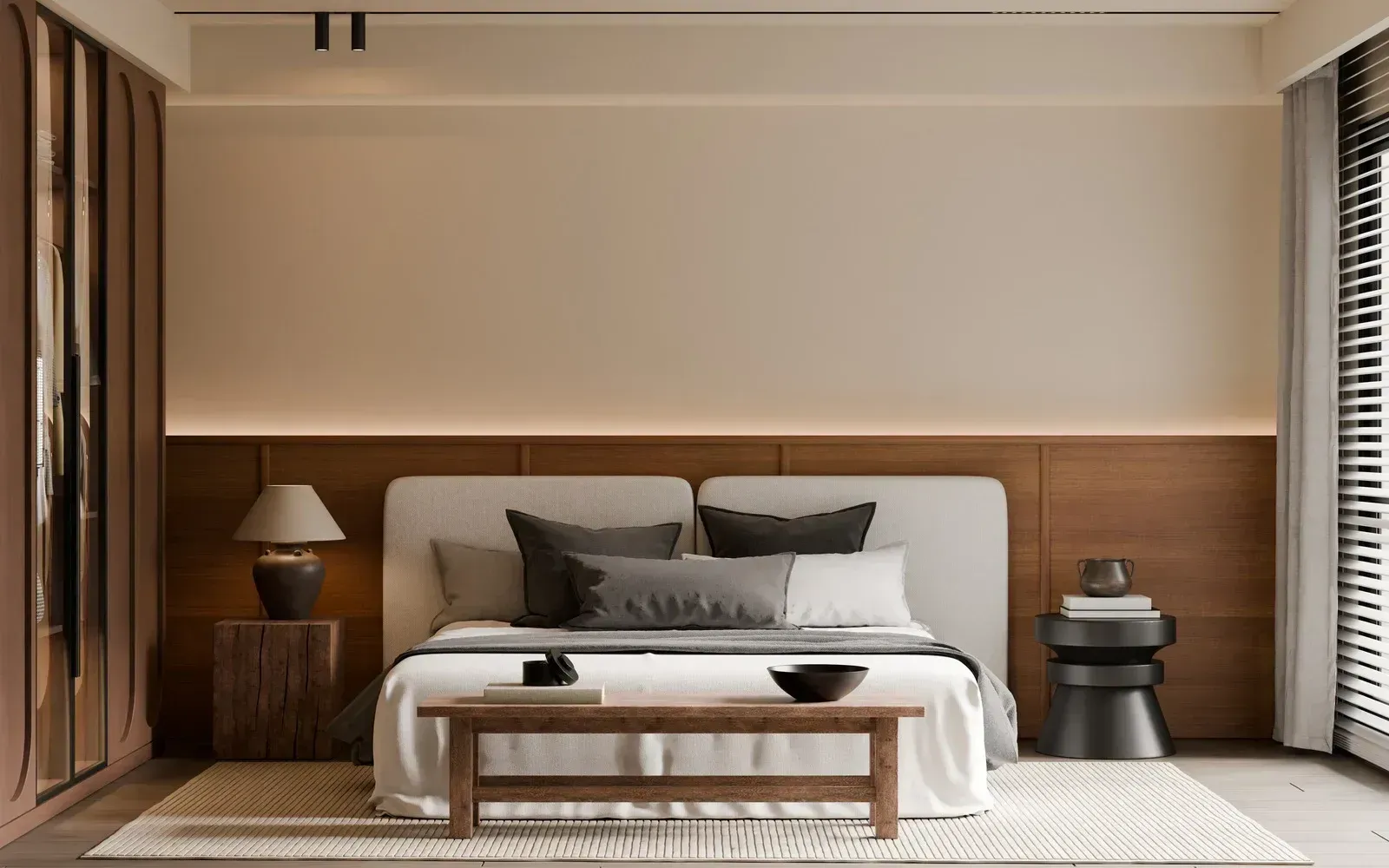 Minimalist bedroom with a bed, wood-paneled wall, bedside lamps, and a bench in front of the bed