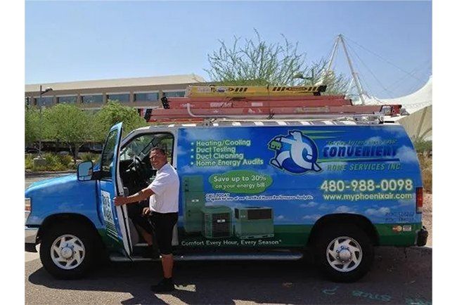 A man is getting out of an air conditioning van