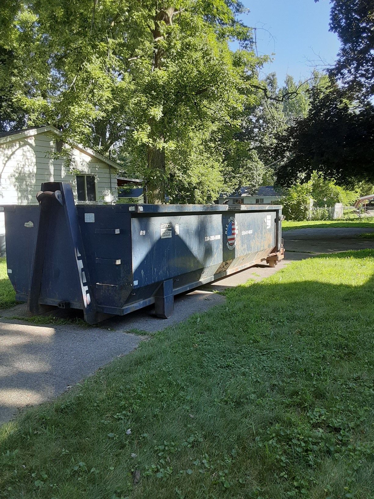 All American Hauling Dumpsters With Junks in It