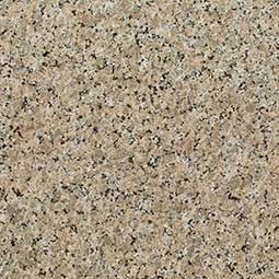 Close-up of beige speckled granite texture with black and gray flecks