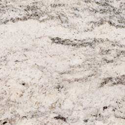 White and gray speckled stone surface with subtle black veining