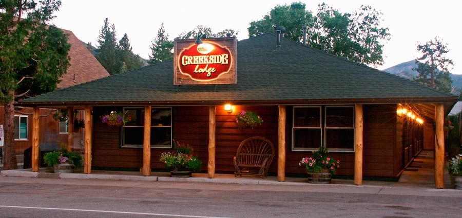 A wooden building with a sign that says osprey lodge