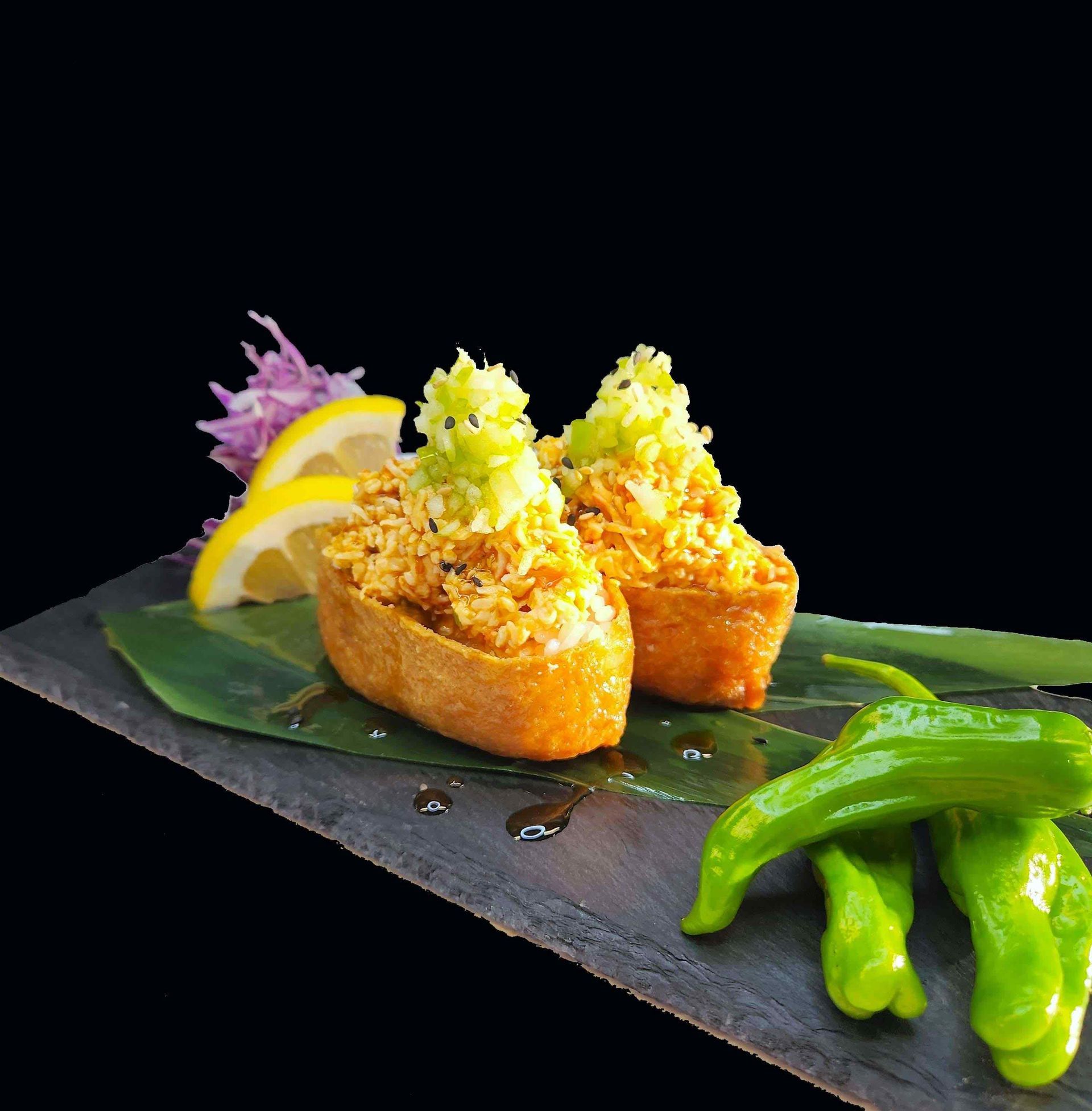 A close up of a plate of food with a black background.