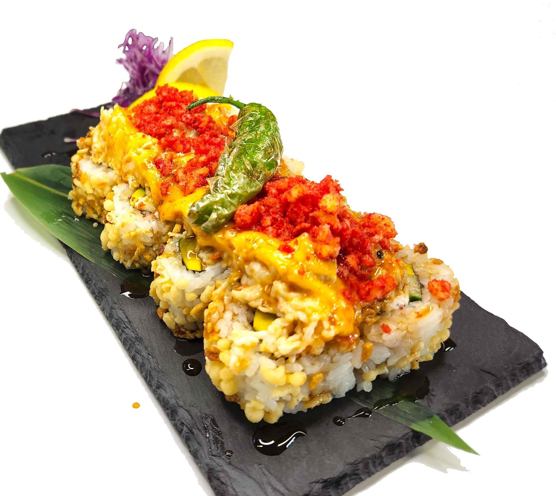 A close up of a plate of food on a table with a white background.