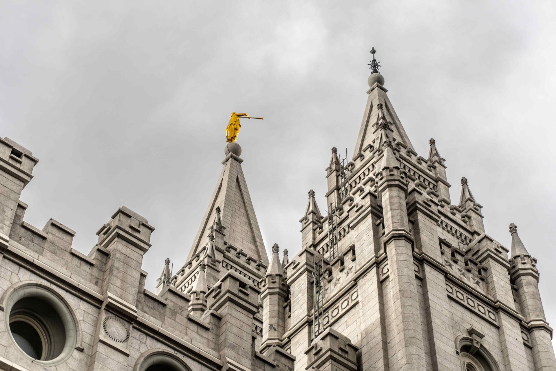A large castle shaped building with a yellow flag on top of it.