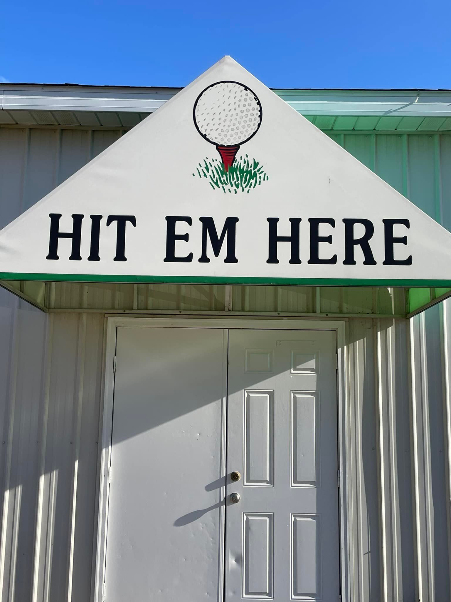 Front door with awning with the text Hit Em Here