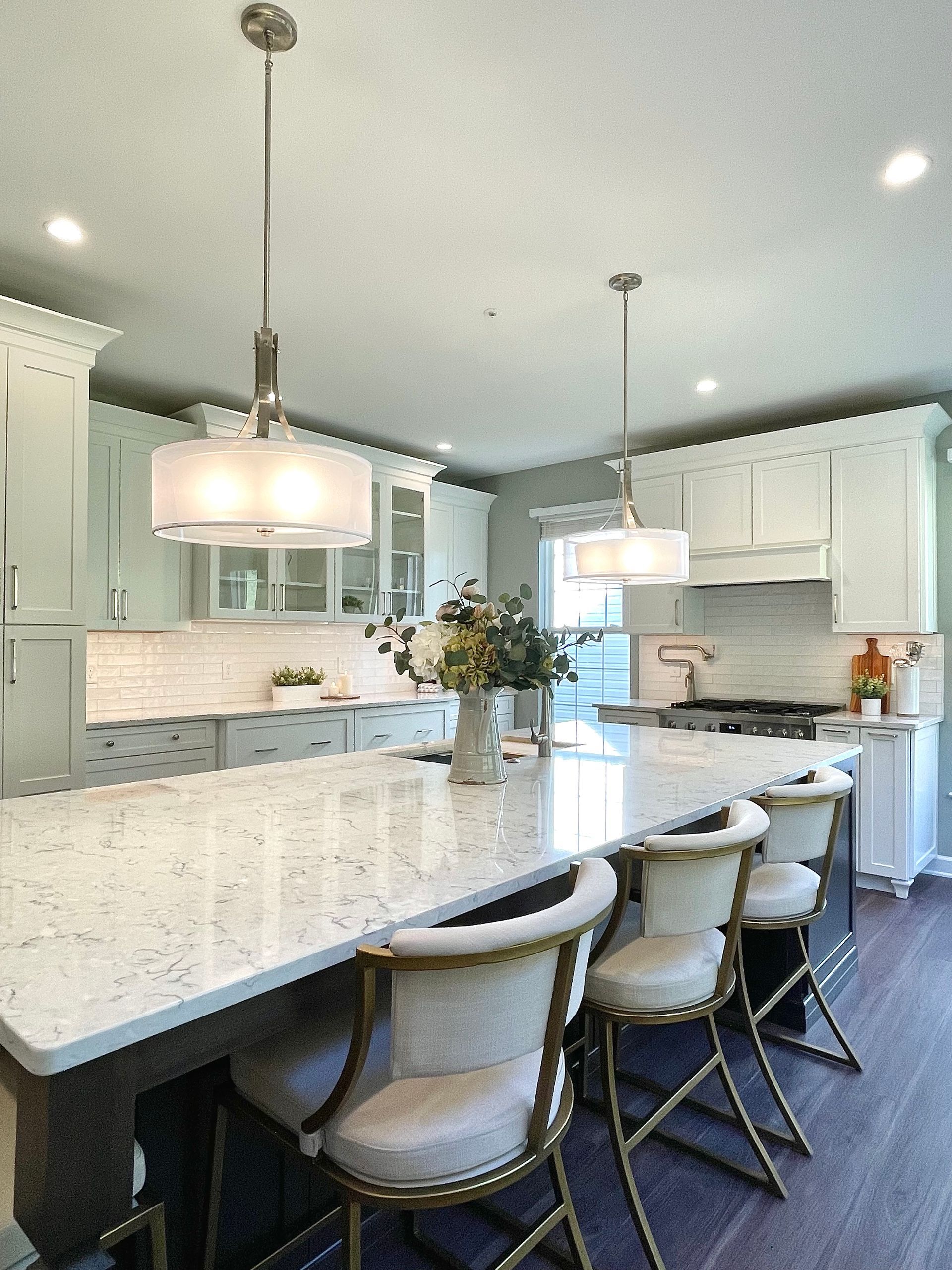 A kitchen with a large table and chairs in it