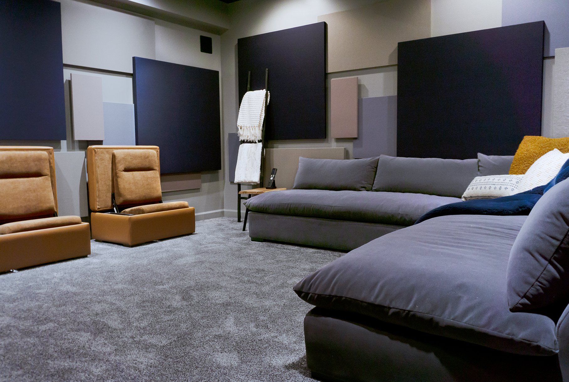 A living room with a sectional couch and chairs