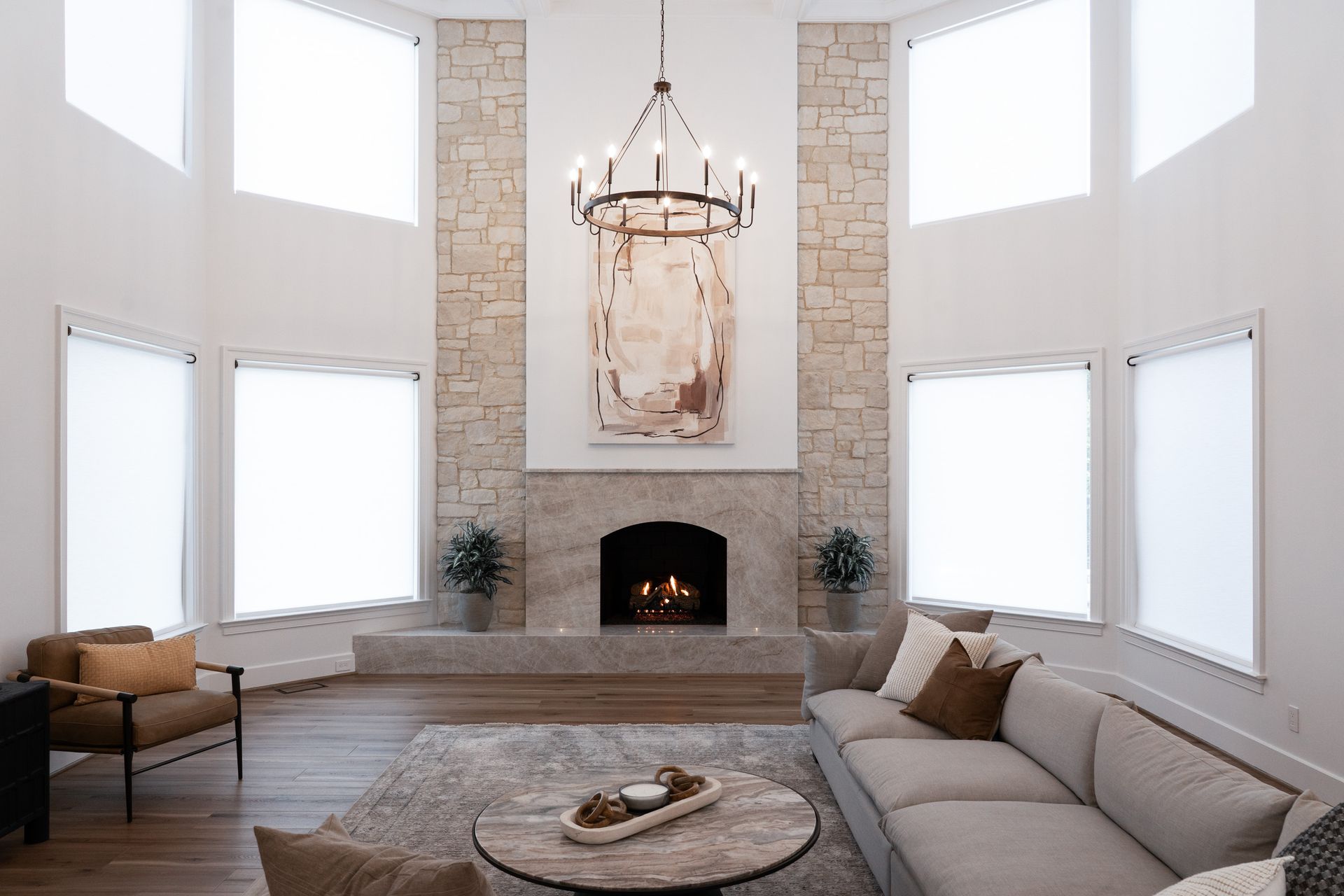 There is a fireplace in the middle of the living room.