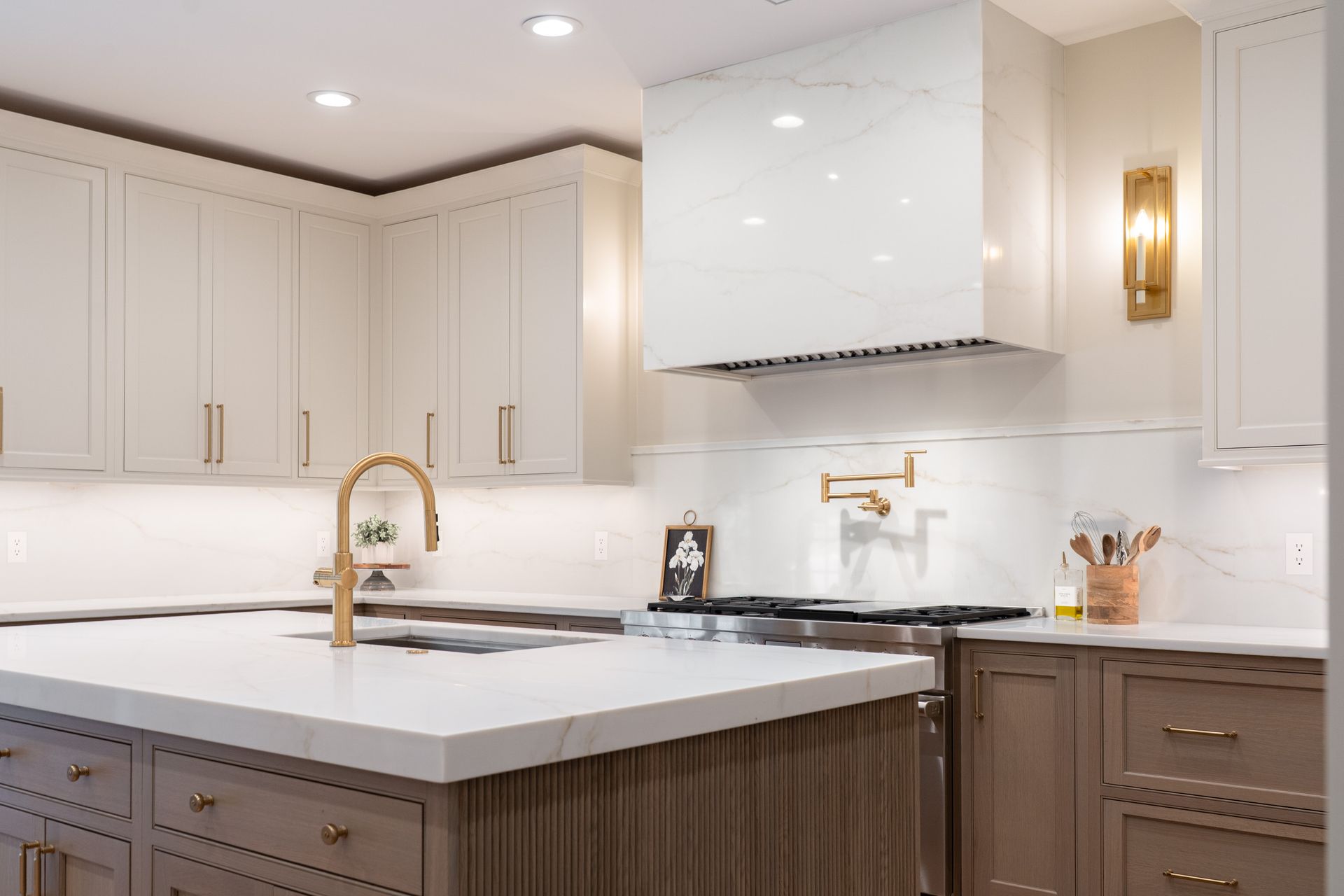 There is a large island in the middle of the kitchen.