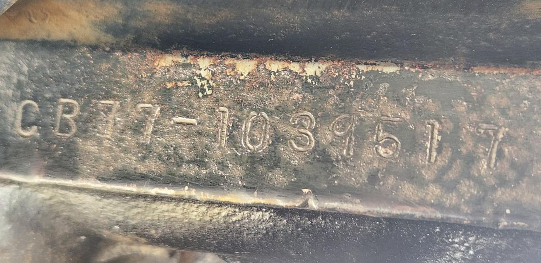 A close up of a piece of metal with a barcode on it.
