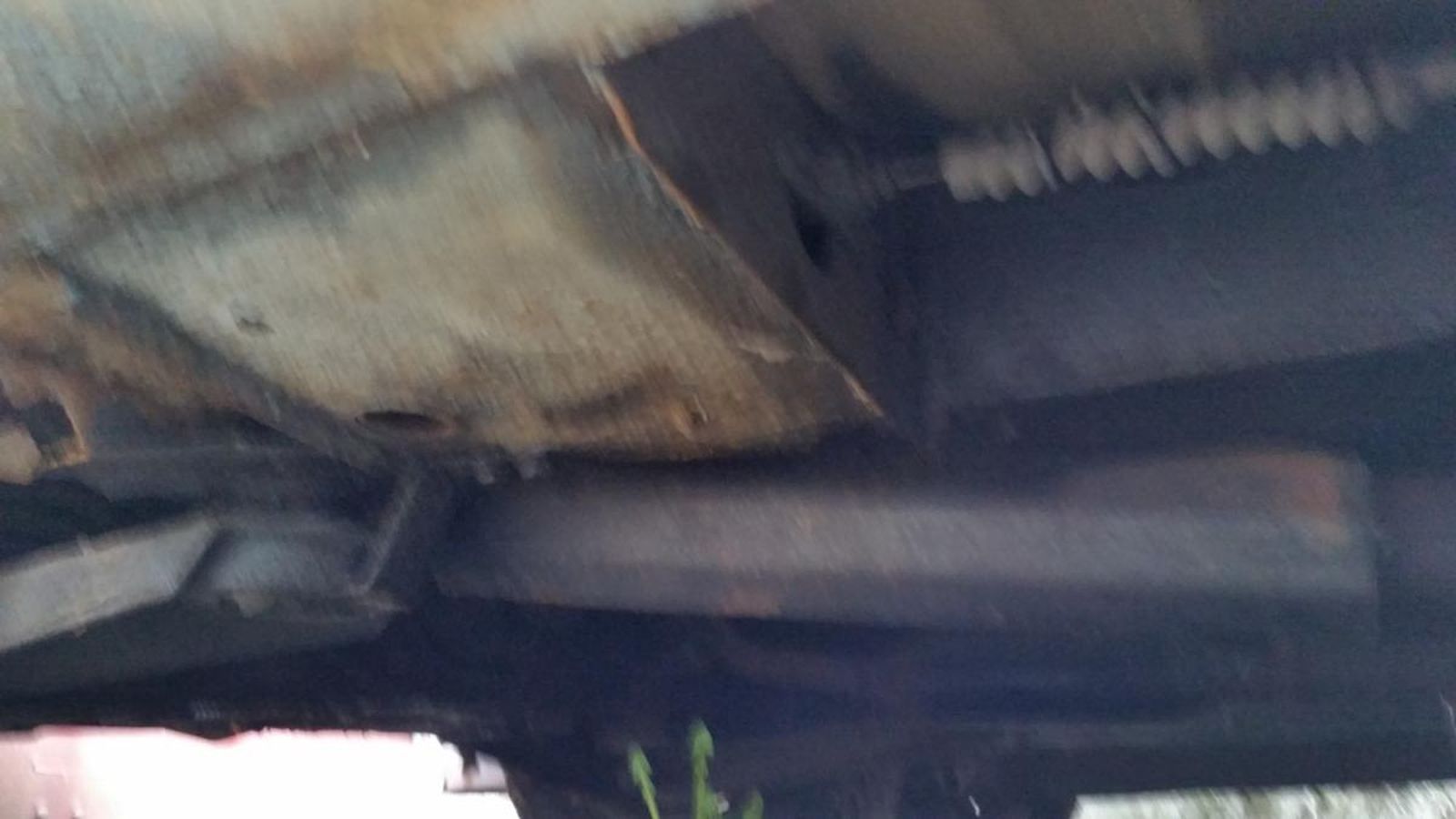 A close up of the underside of a car.