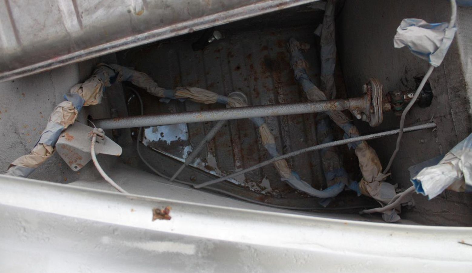 The inside of a car with a lot of wires coming out of it.