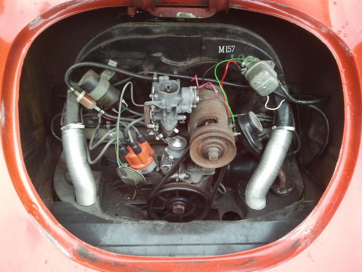 A close up of the engine of a red car