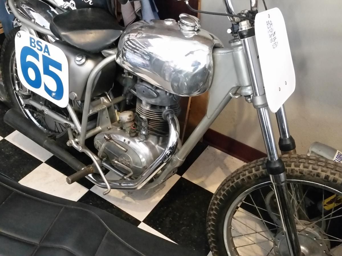 A motorcycle with the number 65 on it