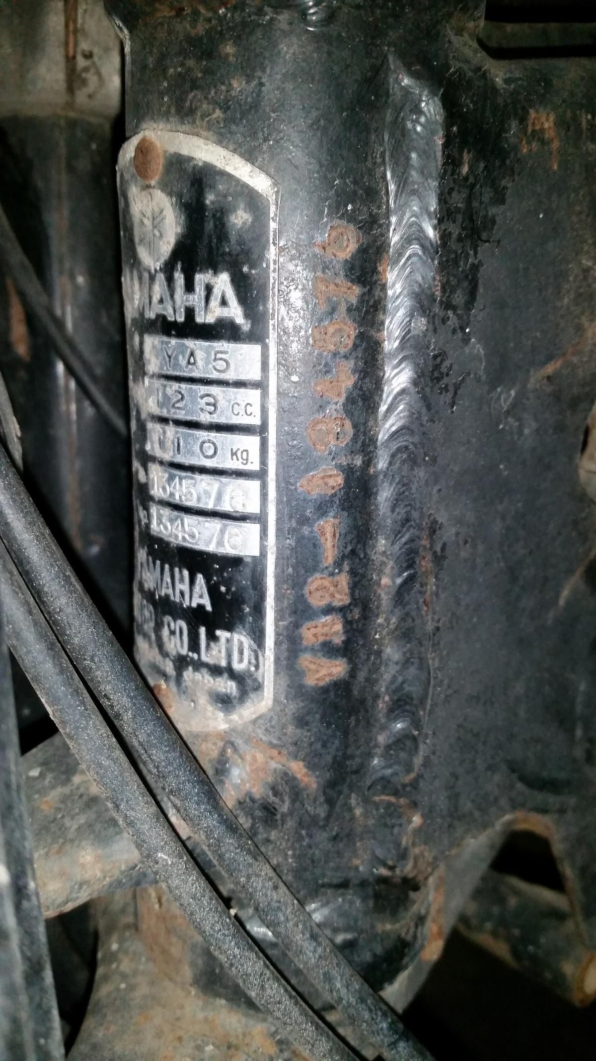 A close up of a motorcycle frame with a label on it.