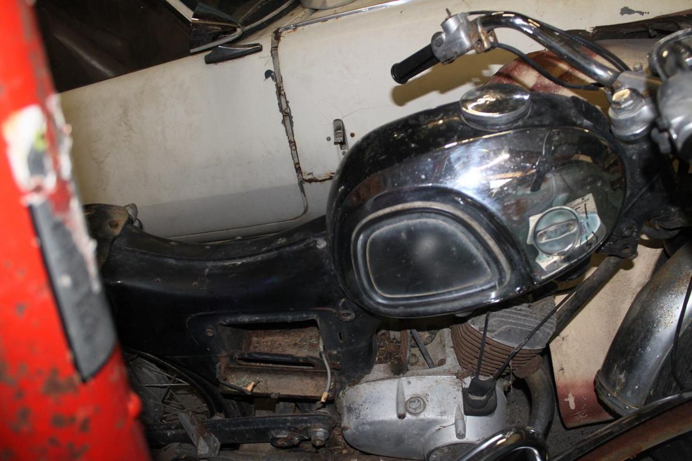 A close up of a motorcycle with a black tank