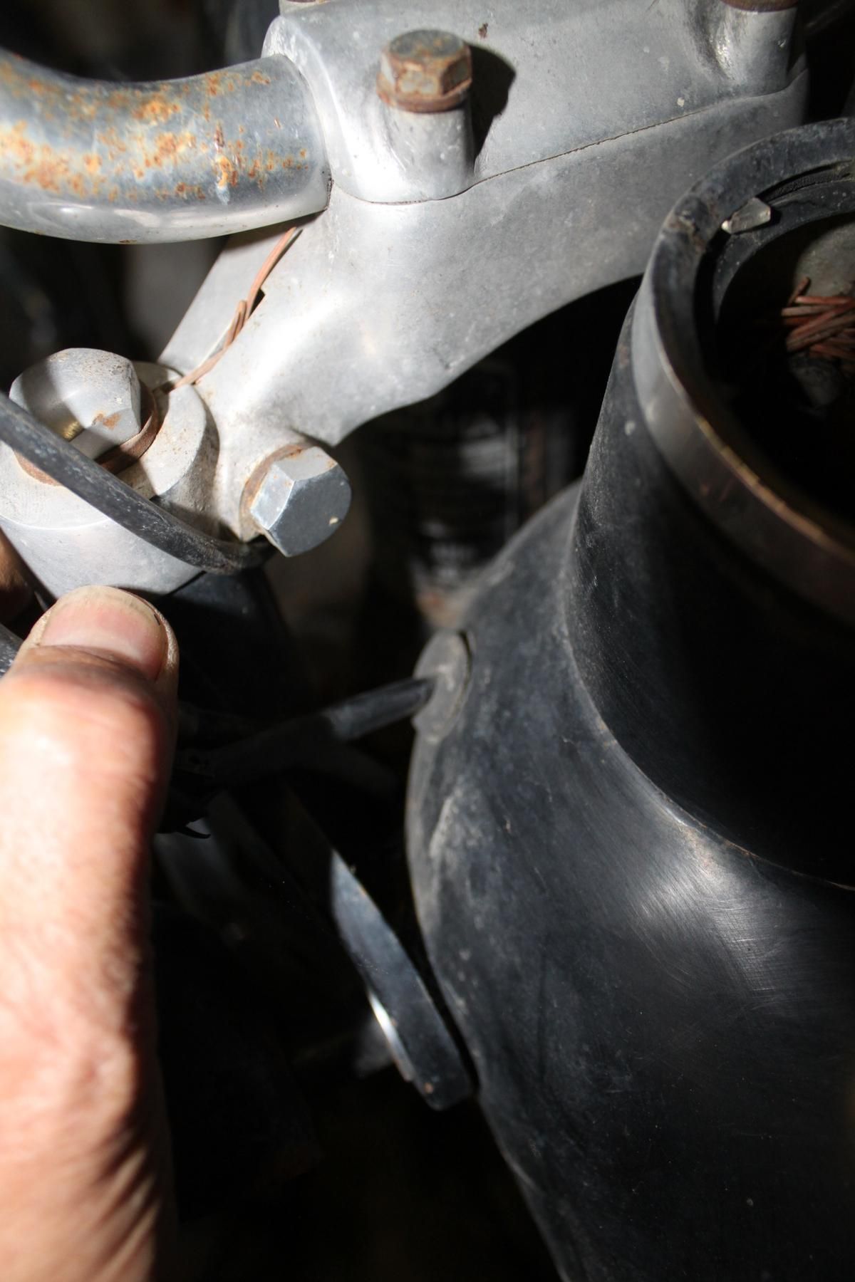 A close up of a person holding a screwdriver
