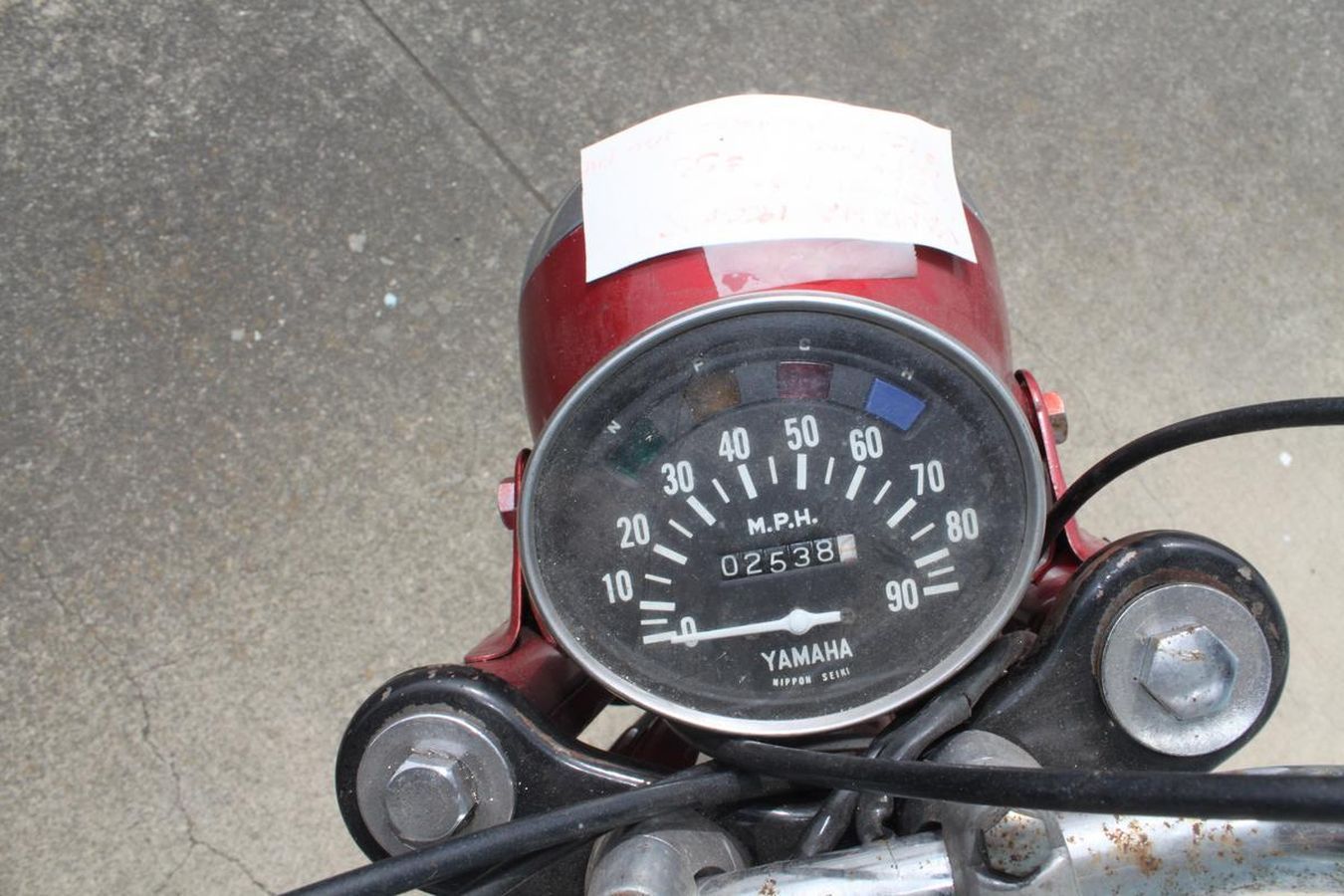 A close up of a yamaha speedometer on a motorcycle