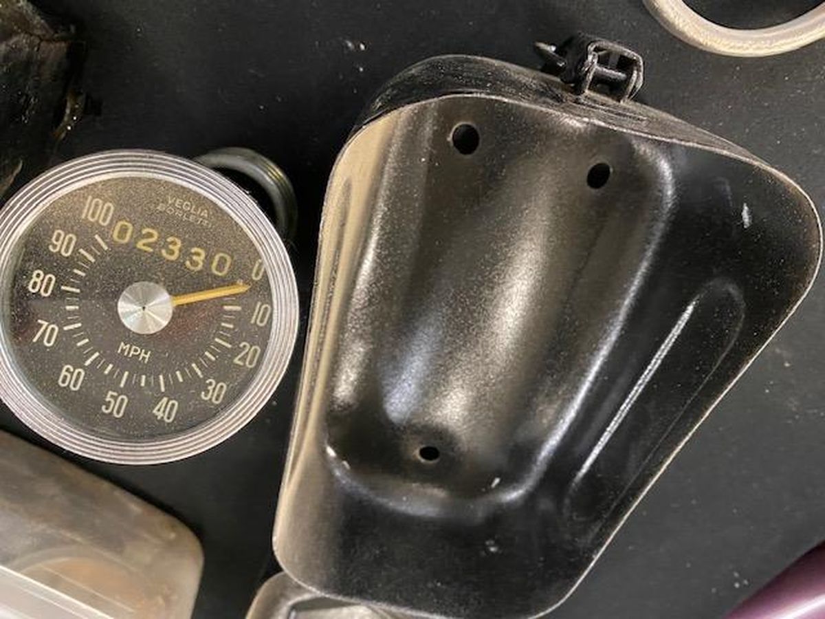 A close up of a speedometer on a table