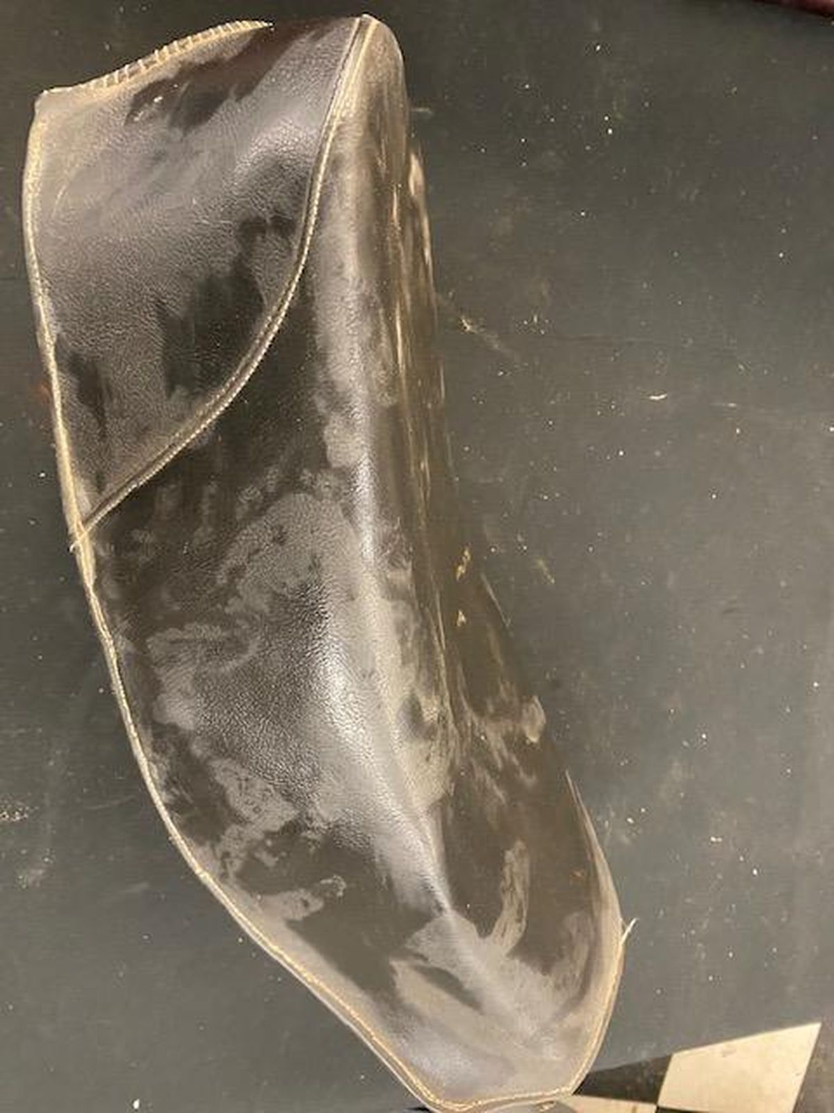 A piece of leather is sitting on a table.