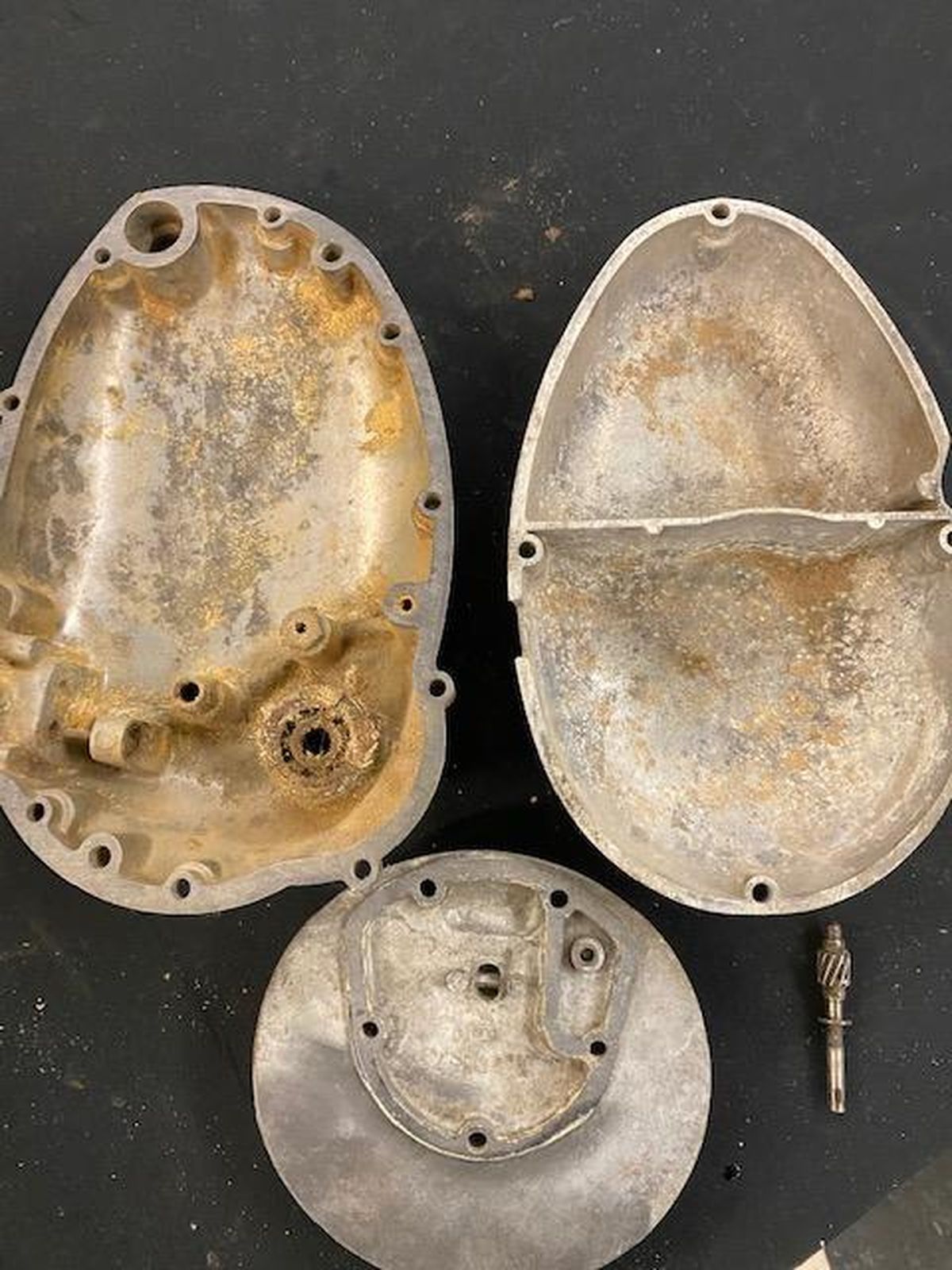 Two pieces of metal are sitting on top of each other on a table.