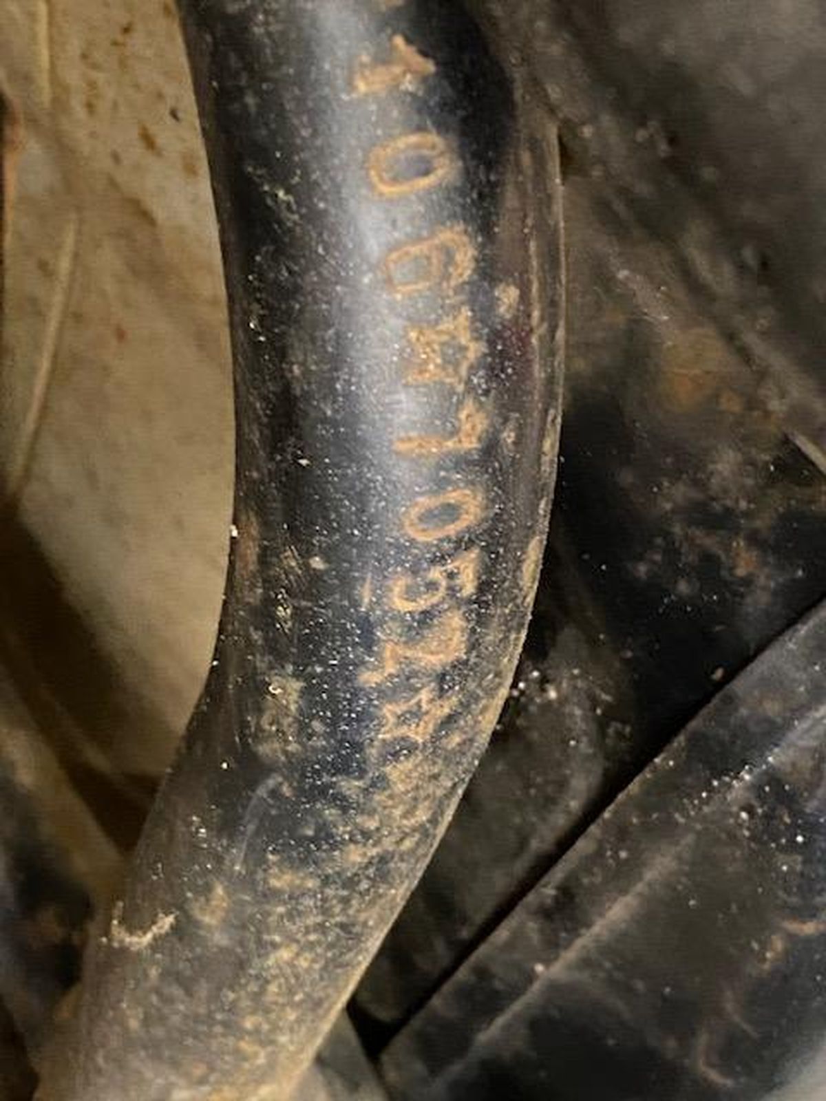 A close up of a black hose with numbers on it.