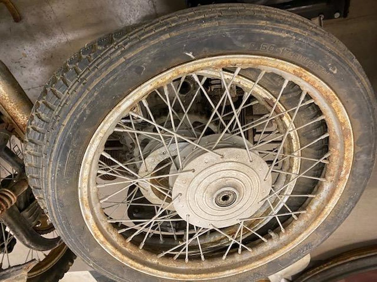 A close up of a motorcycle wheel with a tire on it.