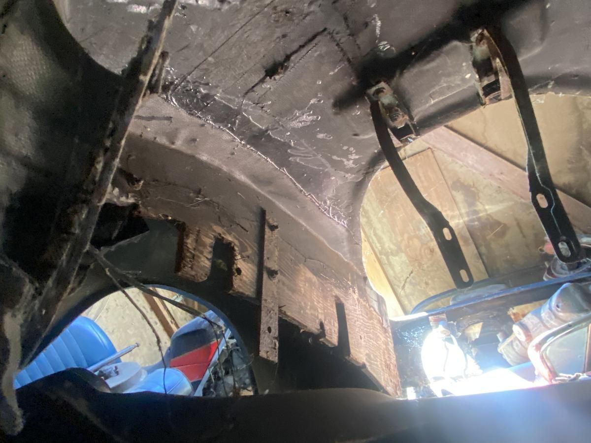 A car is being worked on in a garage.
