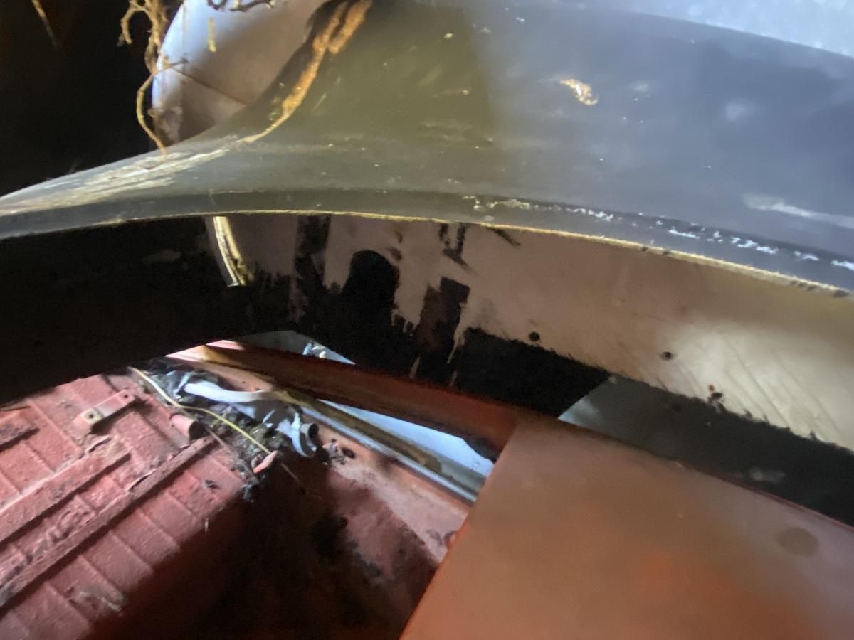 A close up of a car with a hood missing