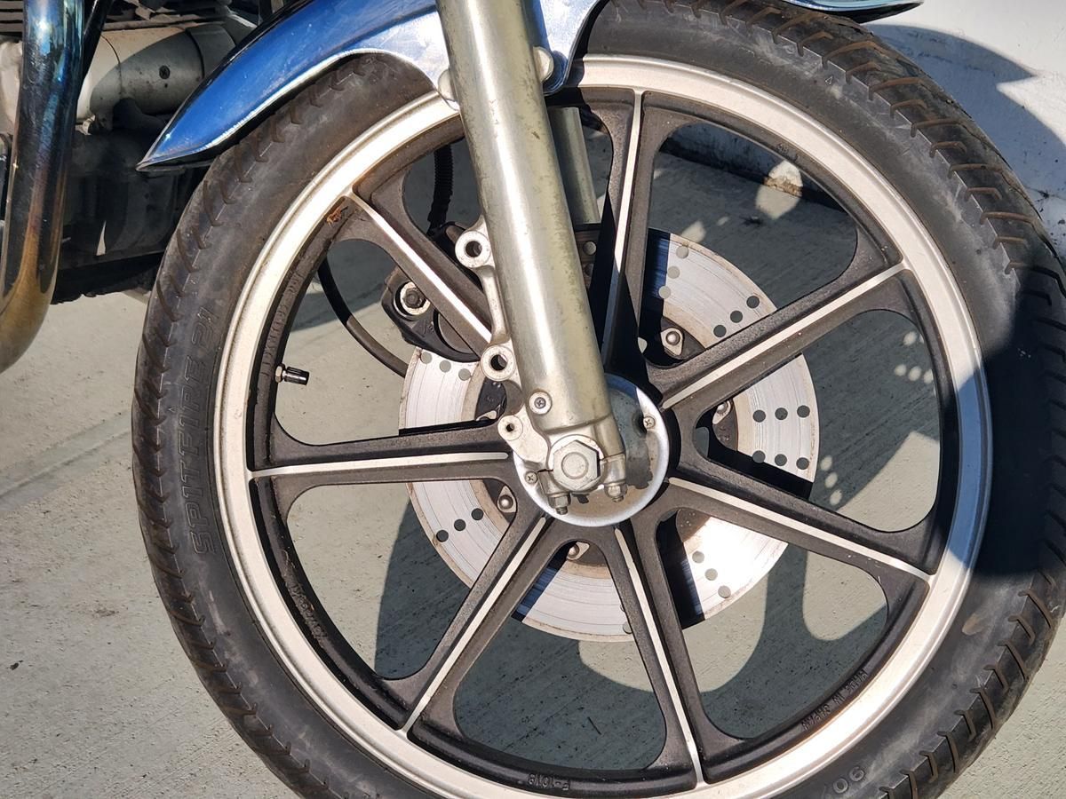 A close up of the front wheel of a motorcycle