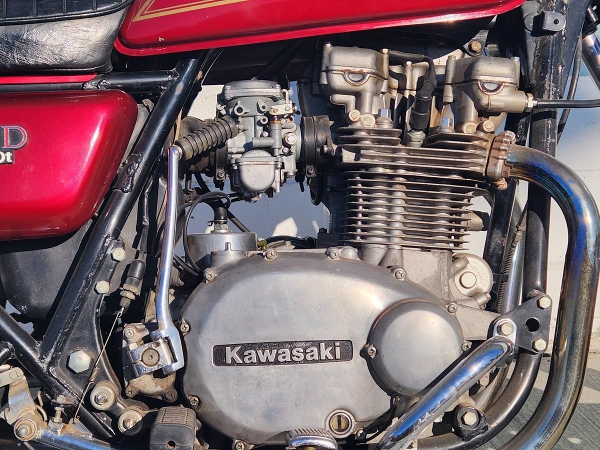A close up of a kawasaki motorcycle engine