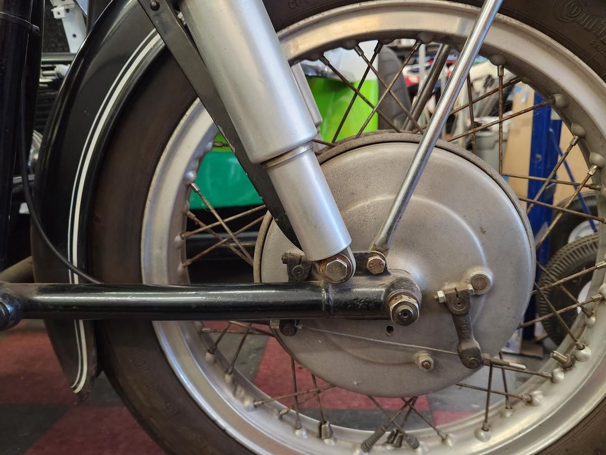 A close up of the front wheel of a motorcycle
