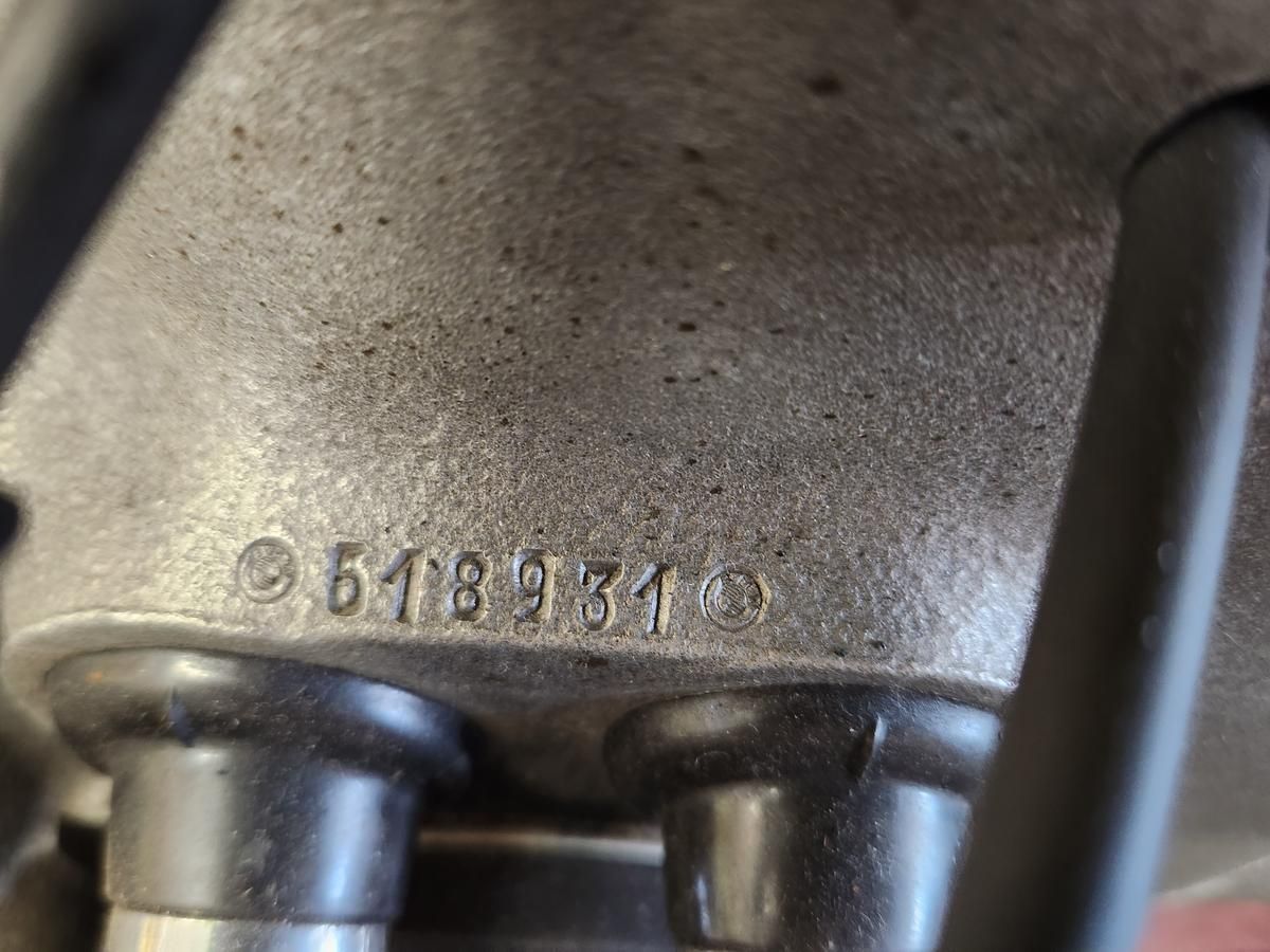 A close up of a metal object with a number on it.