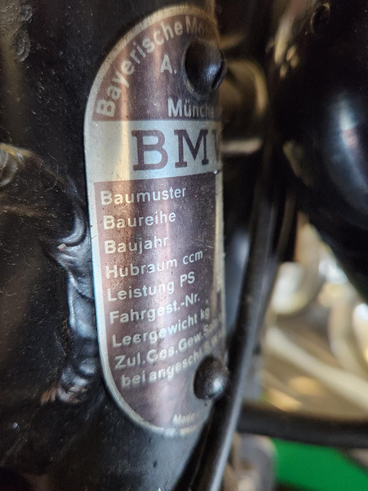 A close up of a label on a motorcycle that says bmw