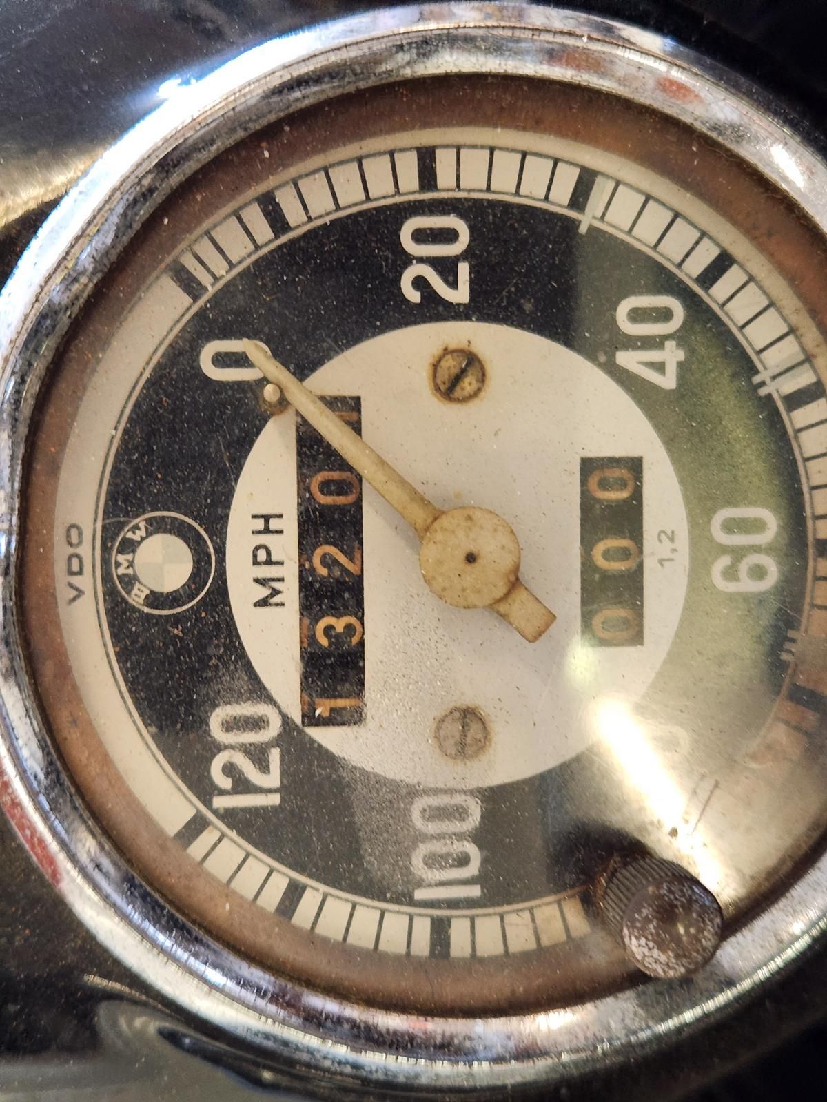 A close up of a speedometer that reads 320 mph