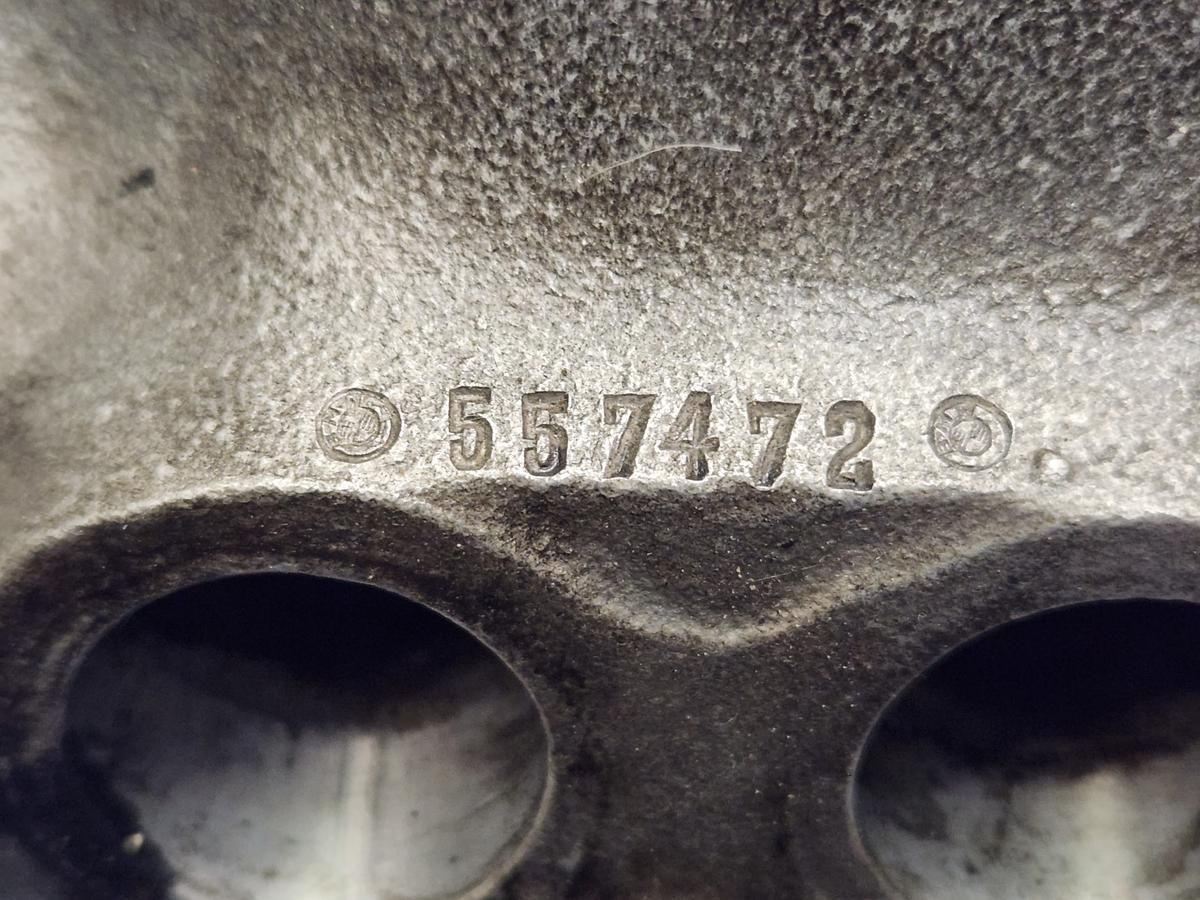 A close up of a metal object with a number on it.