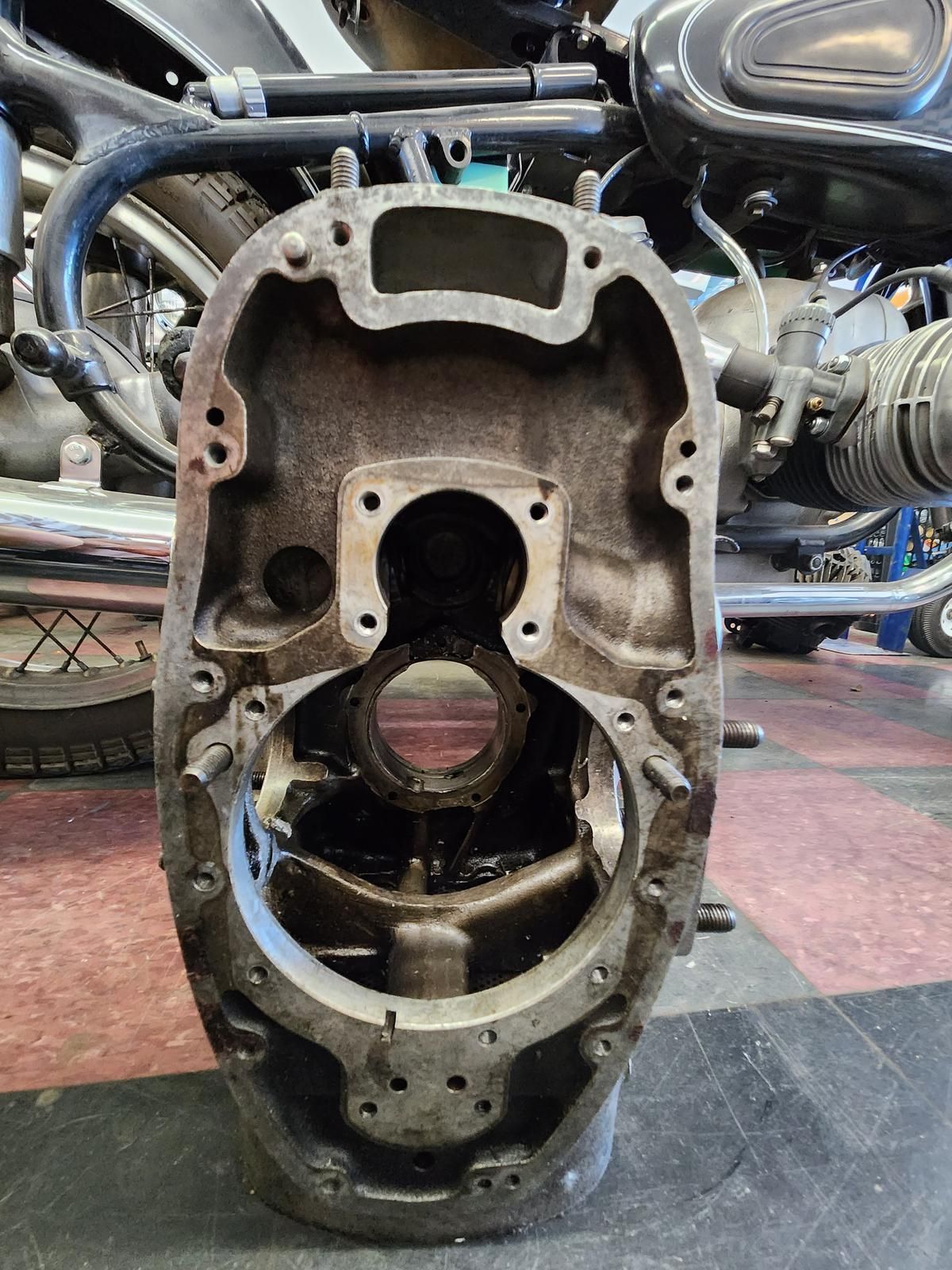 A close up of a motorcycle engine sitting on top of a table.