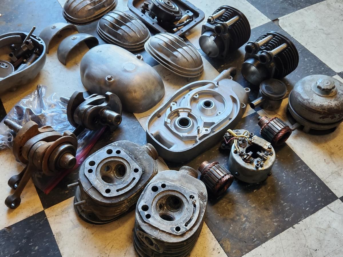 A bunch of metal parts on a checkered floor
