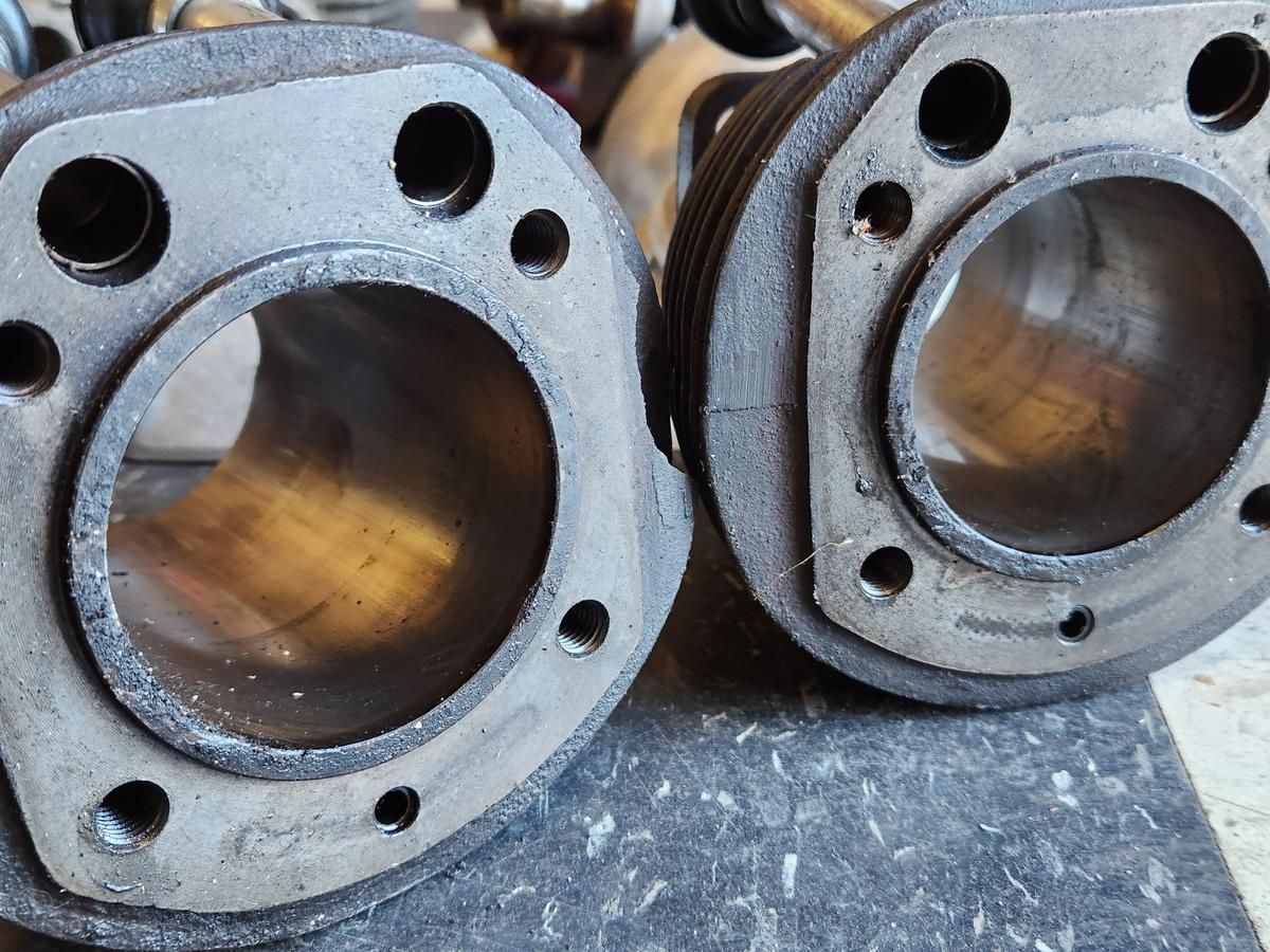 A close up of two cylinders with holes in them
