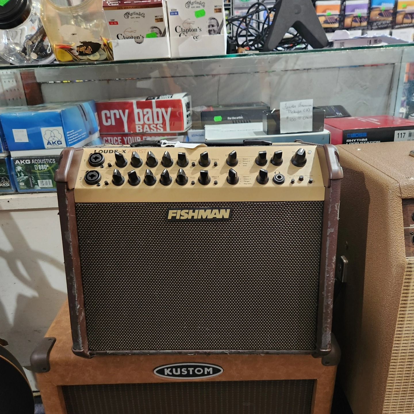 Fishman guitar amplifier atop a Kustom amp in a music store display